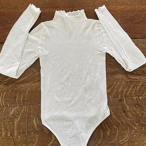 White turtleneck body suit